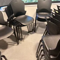 Black Stacking Chairs with Perforated Seat